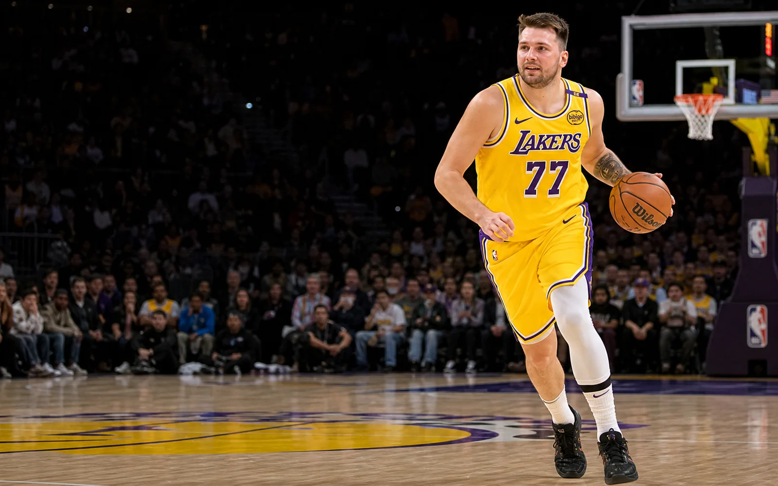 An NBA player dribbles the ball on court during a game.